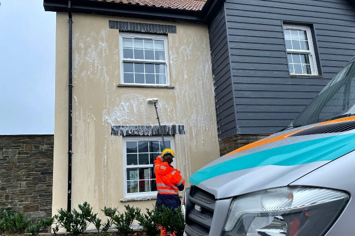 soft-washing a house