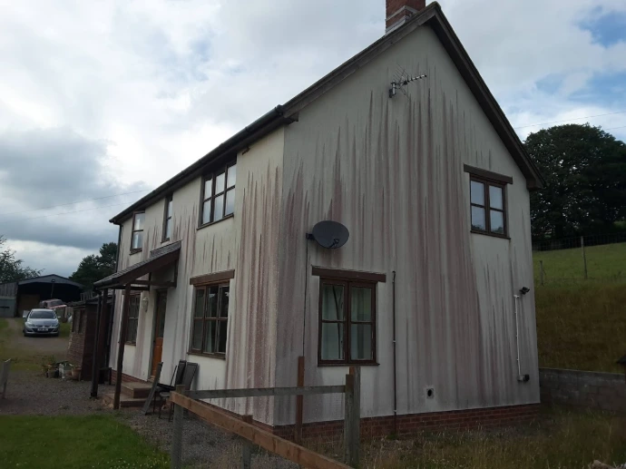 red and black stains on render